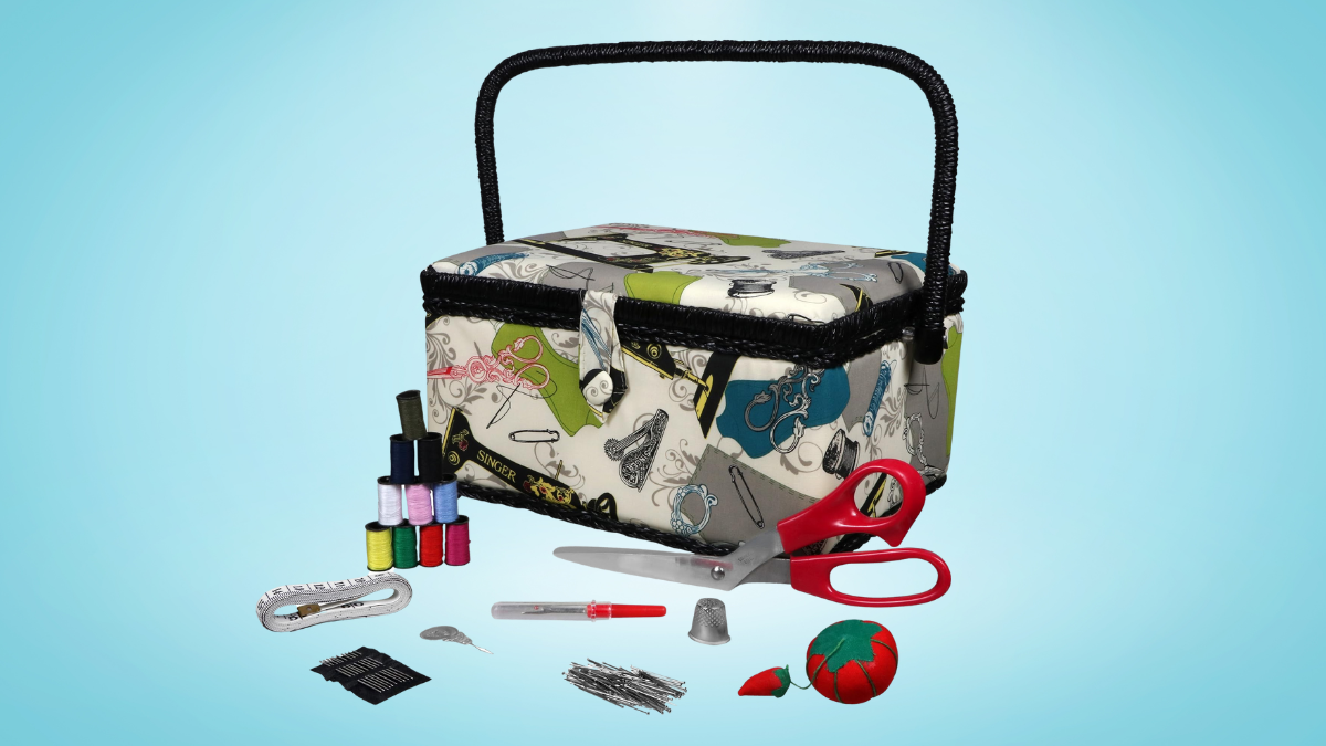 Vintage-inspired sewing basket with a sturdy handle, adorned with colorful patterns, surrounded by sewing essentials.