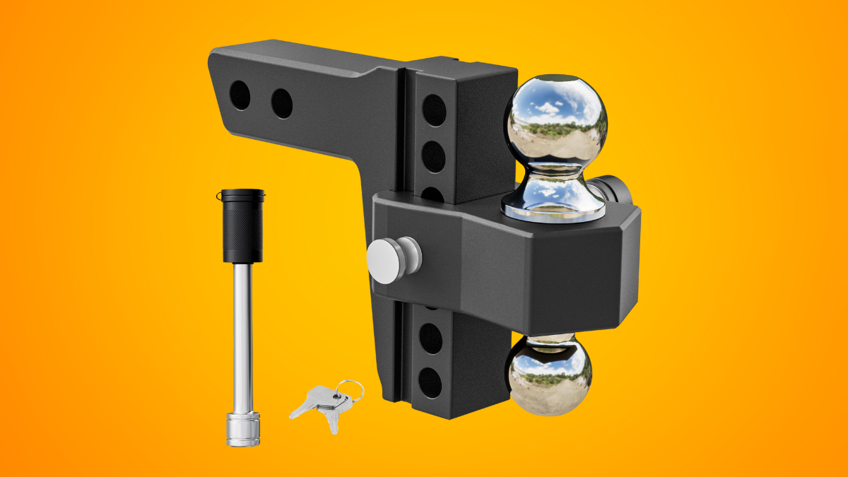A heavy-duty adjustable hitch with dual chrome trailer balls, a locking pin, and keys against a vibrant orange background.