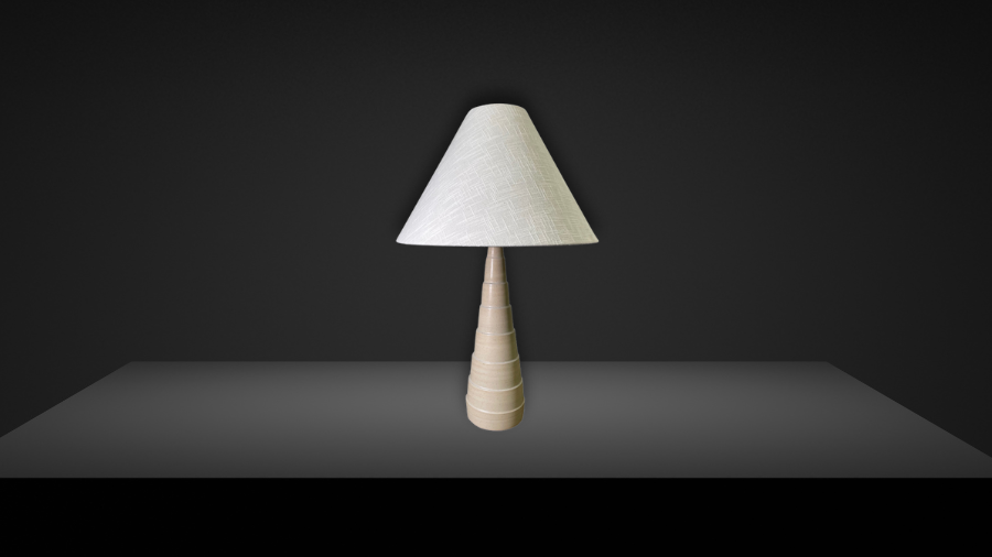 A minimalist table lamp with a conical fabric shade and a tapered wooden base, set against a dark background with soft lighting.