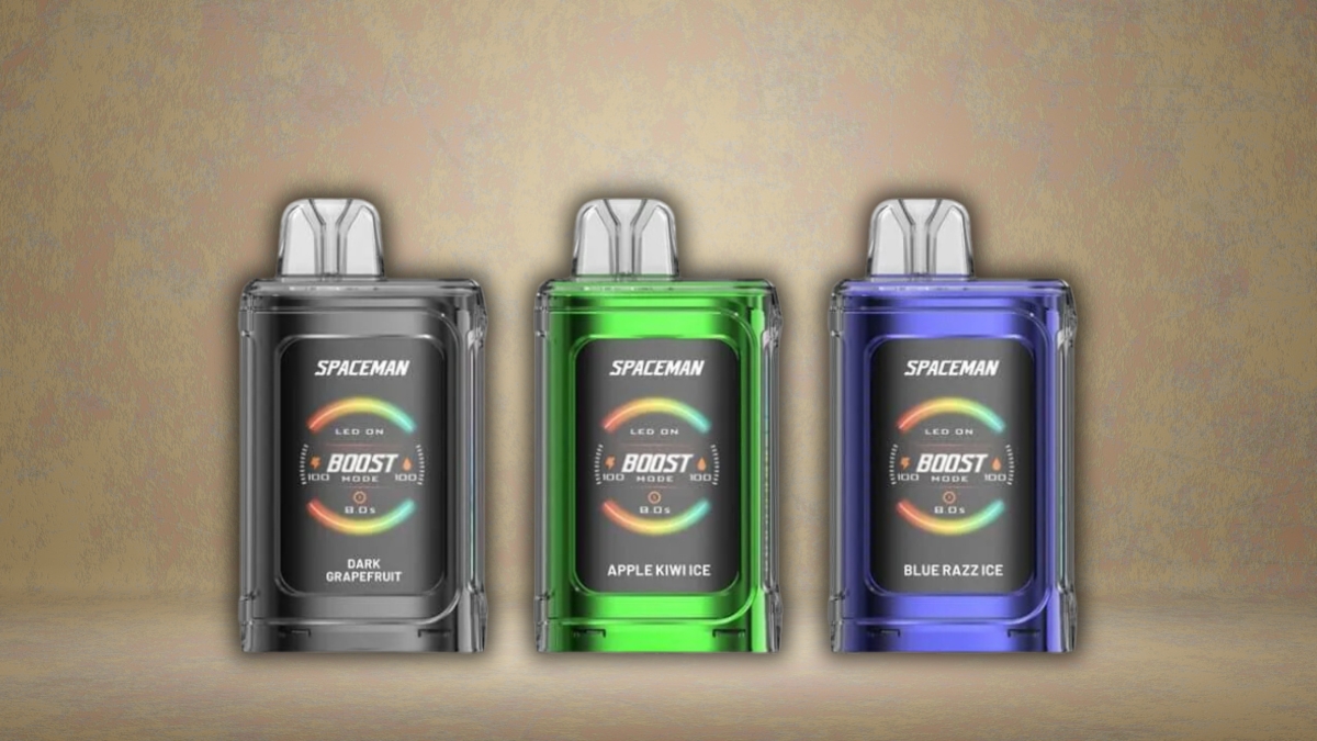 Spaceman Boost Mode disposable vapes with a digital display, showing flavors Dark Grapefruit, Apple Kiwi Ice, and Blue Razz Ice.