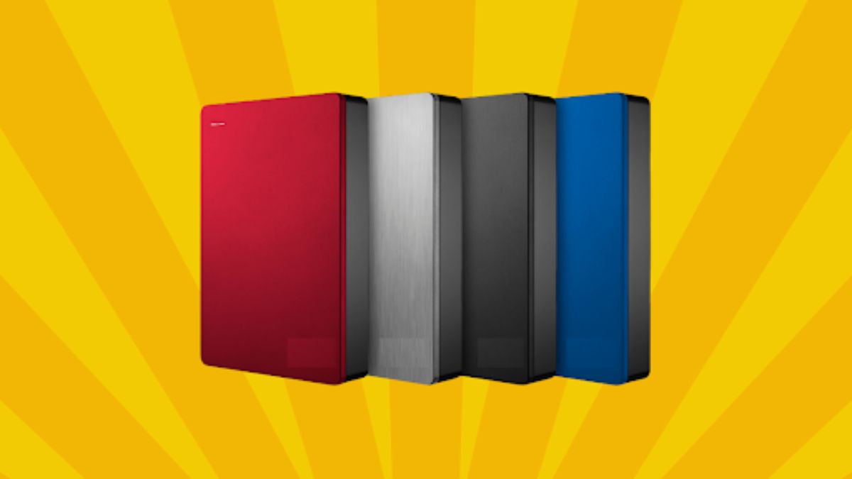Four external hard drives in red, silver, black, and blue, displayed against a vibrant yellow radial background.