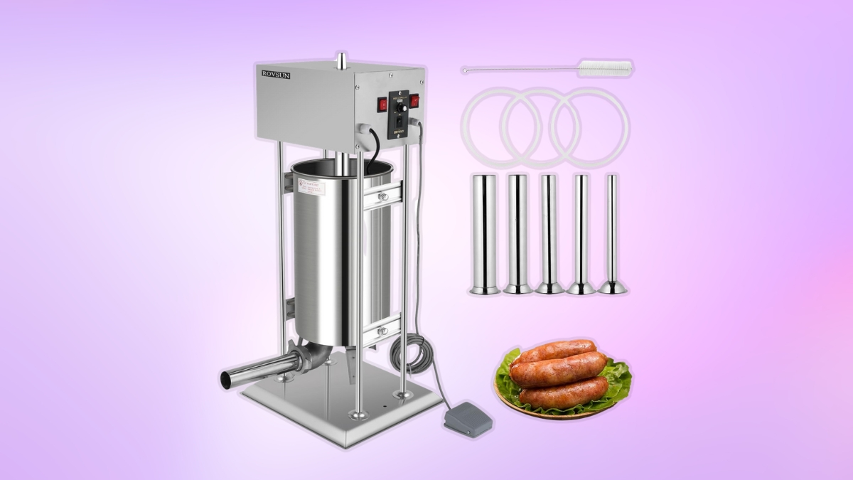 A stainless steel electric sausage stuffer with stuffing tubes, seals, a cleaning brush, and a plate of sausages on a purple background.