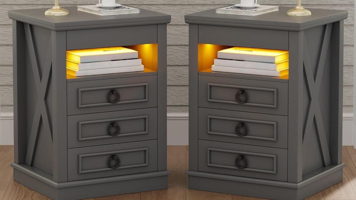 A pair of gray farmhouse nightstands with hidden gun storage, LED lighting, and three drawers, adding style and security to any bedroom.