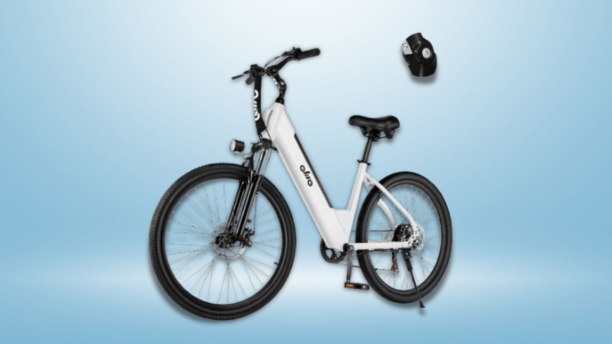 A white Qlife Cityone Electric Commuter Bike with a step-through frame, thick tires, front suspension, and an LCD display, set against a light blue background with a bike lock floating nearby.