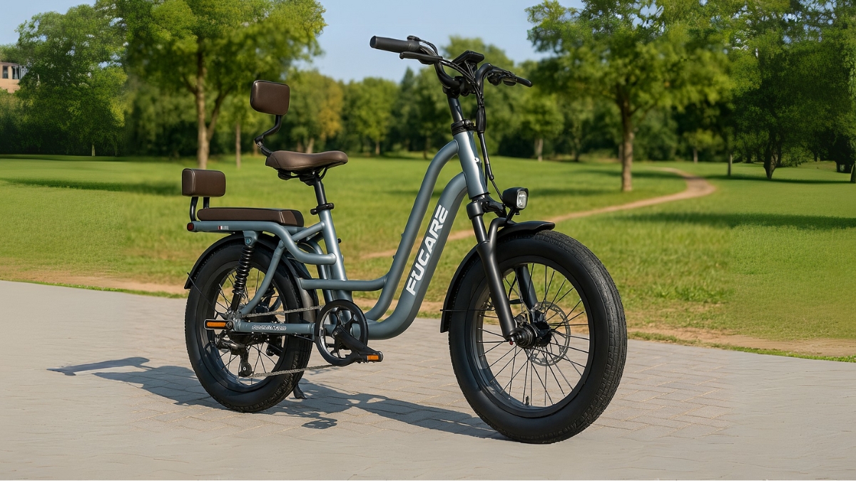 Fucare Libra 1200W electric bike with fat tires and dual seats parked on a paved path in a green park.