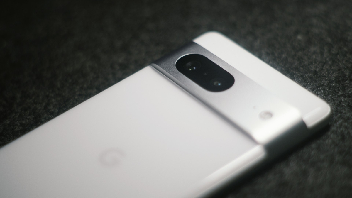 Close-up of the white refurbished Google Pixel 7 showing its rear camera bar design.